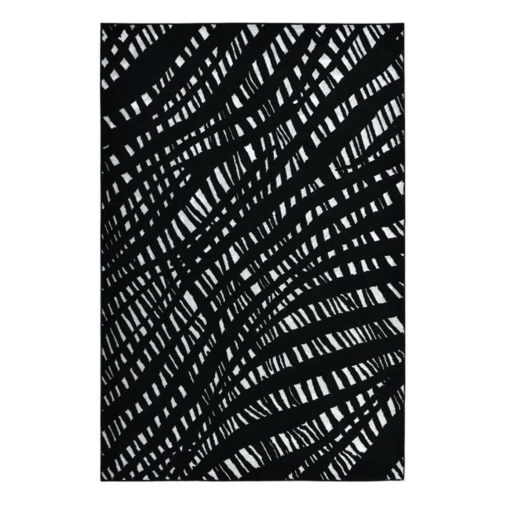 De nuestra colección POLAR: Este tapete color negro con blanco, elaborado con&nbsp;hilo de poliéster brillante de alta calidad, aporta suavidad, estilo y un sutil brillo que realza cualquier espacio. Su diseño contemporáneo y textura confortable lo convierten en una pieza funcional y decorativa para el hogar.

Características:

Tejido a máquina.
Hilo de poliéster brillante de alta calidad.
Textura suave al tacto.
Reverso de algodón para mayor resistencia y durabilidad.
Diseño plegable para fácil almacenamie